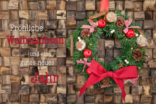 Traditional wreath with decoration for Christmas against a rustic wooden background
