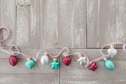 Froehliche decoration for Christmas on background made of wood