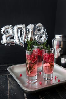 Festive drink with rosemary and pomegranate