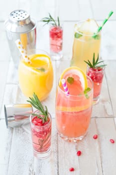 Various colorful cocktails with fruits and herbs