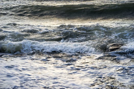 waves of foam spray in the ocean