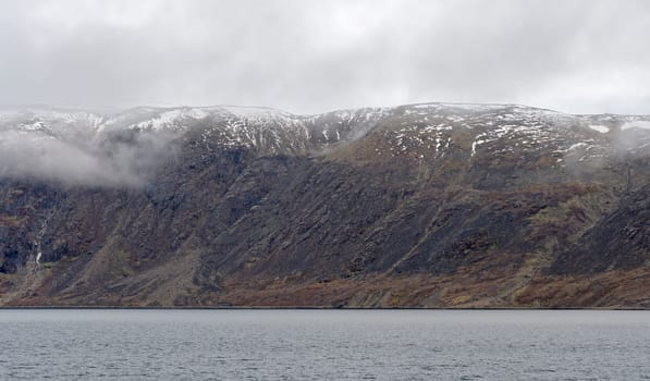 Fog and Fresh Snow on the Coastal Cliffs near Pangnirtung, Nunavut, Canada