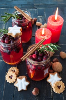 Hot punch with cranberry,cinnamon and rosemary