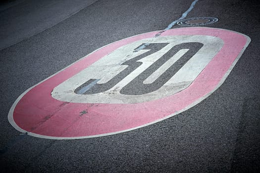 Speed limit on the asphalt of a road in Germany