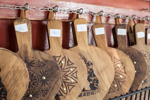 Hanging set of wooden and leather belows for sell at old town madrid shop