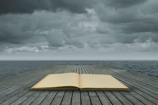 old book on a jetty by the water