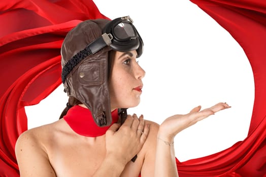 Beautiful girl with freckles wearing helmet, goggles and a red scarf