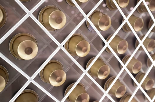 Single-serve coffee containers or coffee capsules. Net shaped sales stand. Closeup