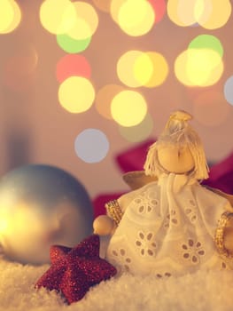 Christmas background with an angel and decoration in snow
