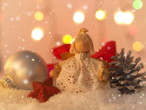Christmas background with an angel and decoration in snow