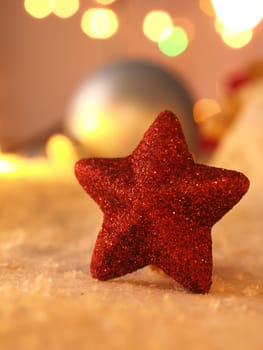 Close up of a red star shape in snow, Christmas background