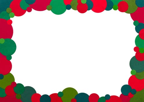 A frame made up of dots of a coloured paper using traditional christmas colours to form a rectangular frame with a white background