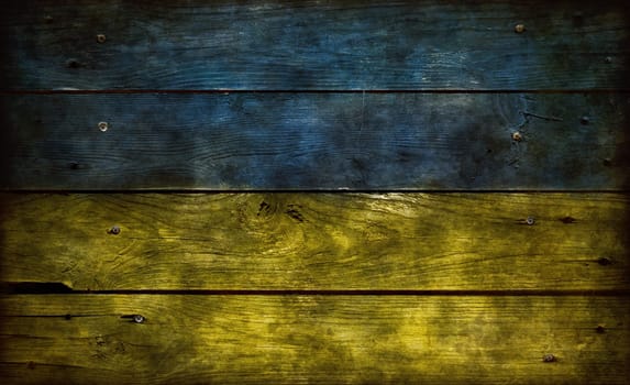 flag of Ukraine on weathered board wall