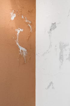 Peeling painted wall, texture, grunge background, cracked paint with orange wall.