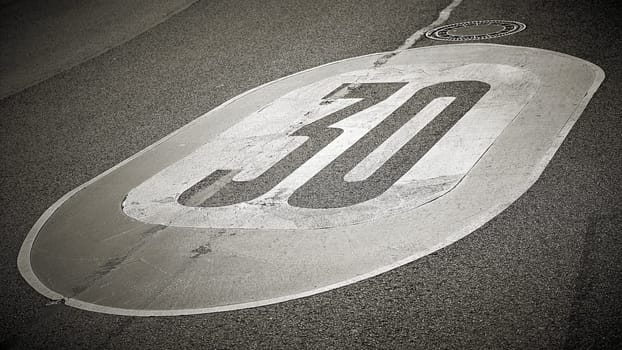 Speed limit on the asphalt of a road in Germany