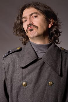 young man dressed as russian military, studio picture