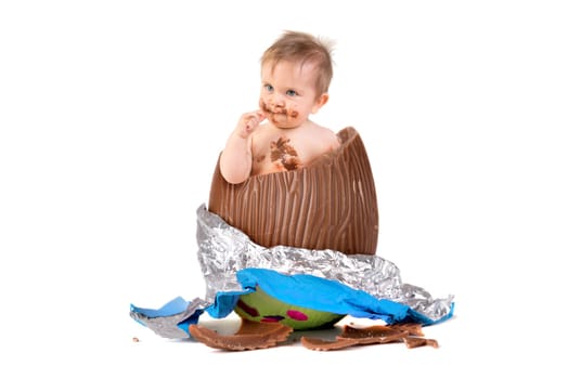 Sweet baby inside an Easter egg isolated in white