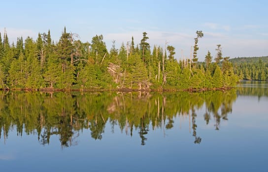 Evening Reflections on Lake Ogishkemuncie in the Boundary Waters Wilderness in Minnesota