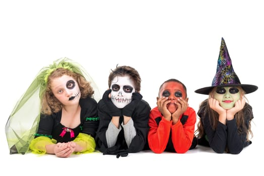 Kids with face-paint and Halloween costumes isolated in white
