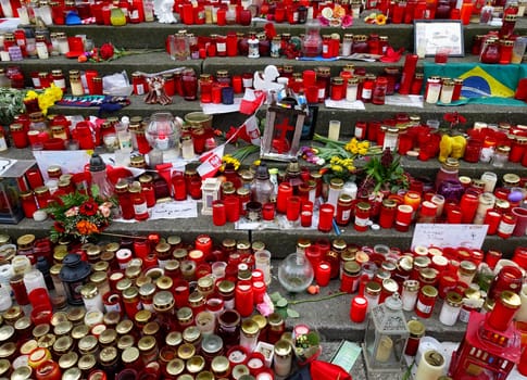 Mourning candles at Berlin's Breitscheidplatz in Berlin to commemorate the terrorist attack on the Christmas market at the Memorial Church. In the attack on December 19,2016,the Islamist assassin Anis Amri shot the Polish freight forwarder of a semitrailer,robbed the truck and drove him into a crowd at the Christmas market around 8 p.m.