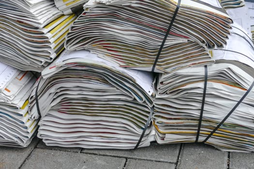 Stacks of newspapers in detail on the road