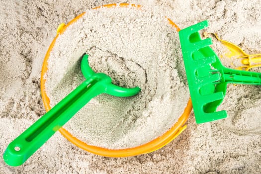 Sandbox with children's toys in detail