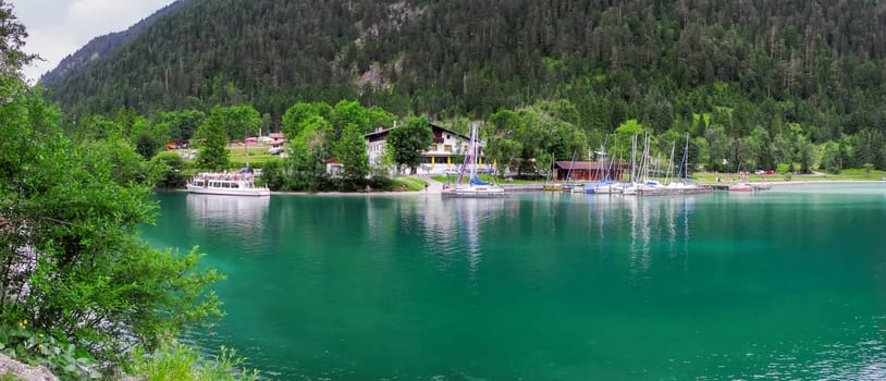 Plansee,Austria - July 07,2017: Panoramic view of the campsite Seespitze,hotel and marina on the opposite shore.