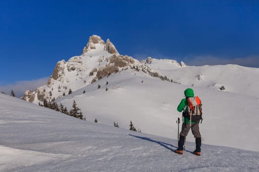 climbing on mountain in winter. Ciucas Mountains, Romania