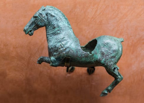 Merida, Spain - December 20th, 2017: Roman figure of wounded galloping horse. National Museum of Roman Art in Merida, Spain