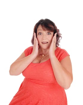 A close-up image of a frightened woman holding her hands on her face.with her mouth and eyes open, isolated for white background.