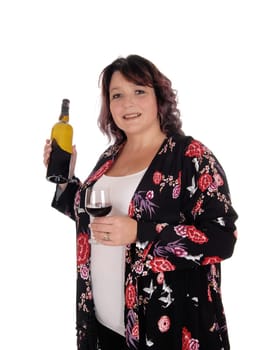 A happy and heavy woman standing with a bottle wine and a glasses.full, smiling, isolated for white background.