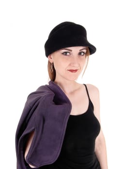 A beautiful woman with a hat and her winter coat over her shoulder.standing in close up, isolated for white background.