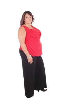 Beautiful full sized woman standing in a red blouse and black trousers.in profile, isolated for white background.