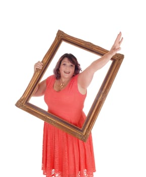 An over sized woman in a red dress holding a picture frame and waving.with her hand trough, isolated for white background.