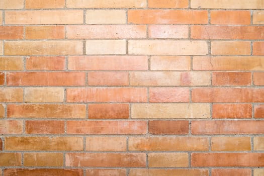 Weathered stained old brick wall background.