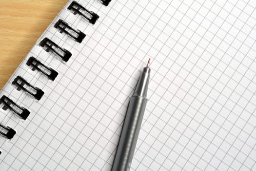 Checkered notepad with pen