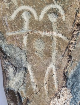 Badajoz, Spain - November 21, 2017: Dancing figures belonging to Warrior Stela of Zarza Capilla III. Badajoz Archeological Museum