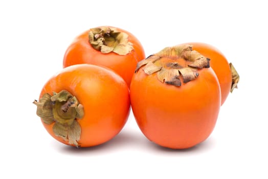 Persimmon fruits on white background.