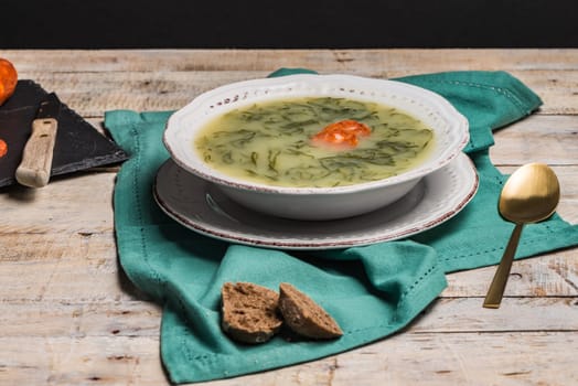 Caldo verde popular soup in Portuguese cuisine. traditional ingredients for caldo verde are potatoes, collard greens , olive oil and salt. Additionally garlic or onion may be added.