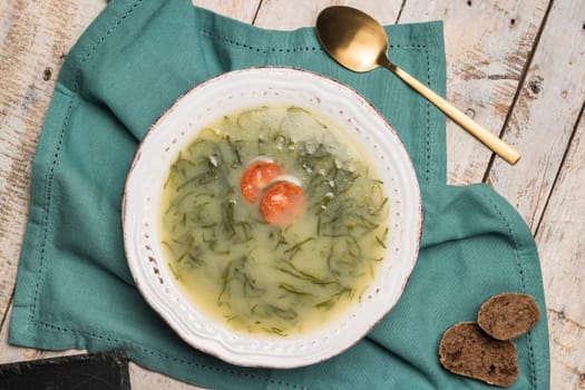 Caldo verde popular soup in Portuguese cuisine. traditional ingredients for caldo verde are potatoes, collard greens , olive oil and salt. Additionally garlic or onion may be added.