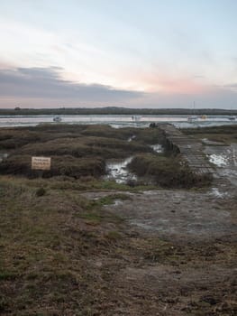 empty landscape wooden path walkway west mersea pontoon jetty  west mersea, essex, england, uk