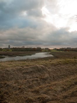 stream estuary running through countryside autumn Alresford Creek church  essex  england  uk