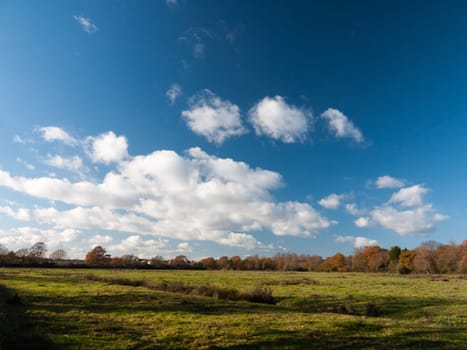 white clouds blue open sky space green grass land farm  essex  england  uk