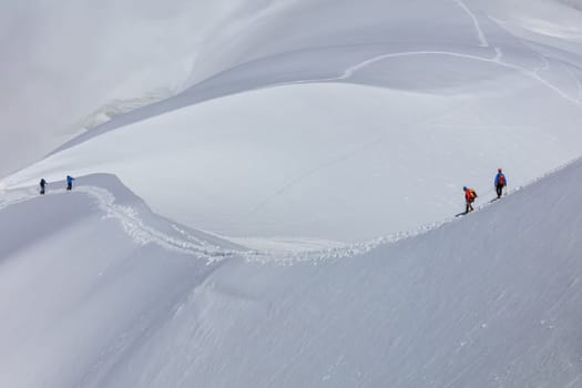 Climbers on the Mont Blanc massif. View from Aiguille du Midi Mount 3842 m France