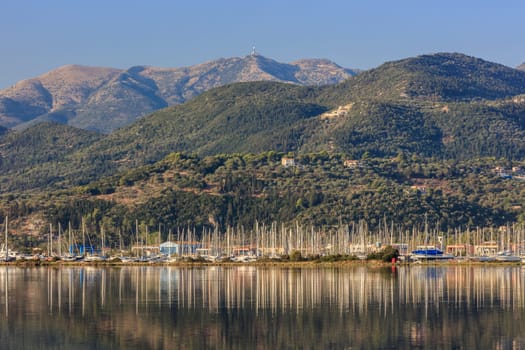 Sailboats in the marina and the city of Lefkada island Greece
