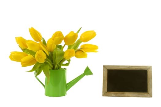 Yellow tulips with an empty board