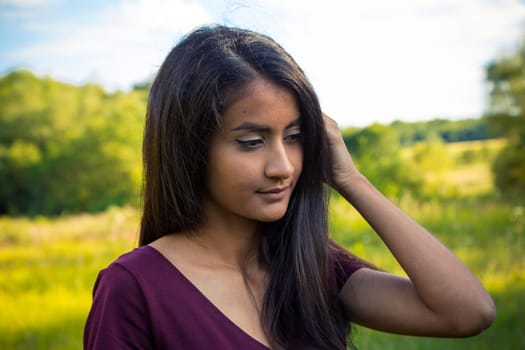 Portrait of a young woman with long black hair
