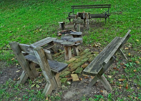 Wooden table and benches for relaxing in park
