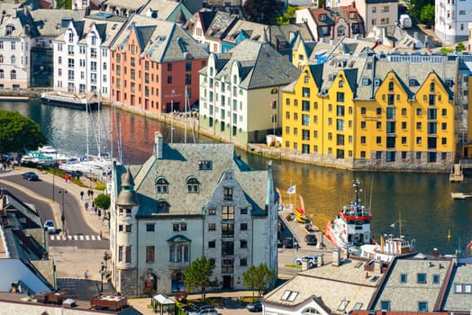 Alesund, Norway - 26 July, 2013: view of central city part with historic art nouveau architectural style in which most of the town was rebuilt after a fire in 1904. Popular tourist destination in Scandinavia, Europe.