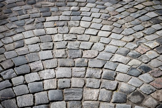 old beautiful cobblestone road in city of Europe